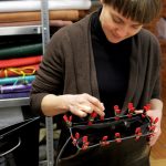 Anke Runge works on bag